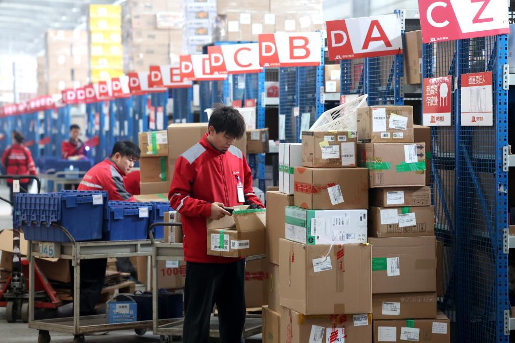 Package arrived in warehouse and being scanned before international shipping