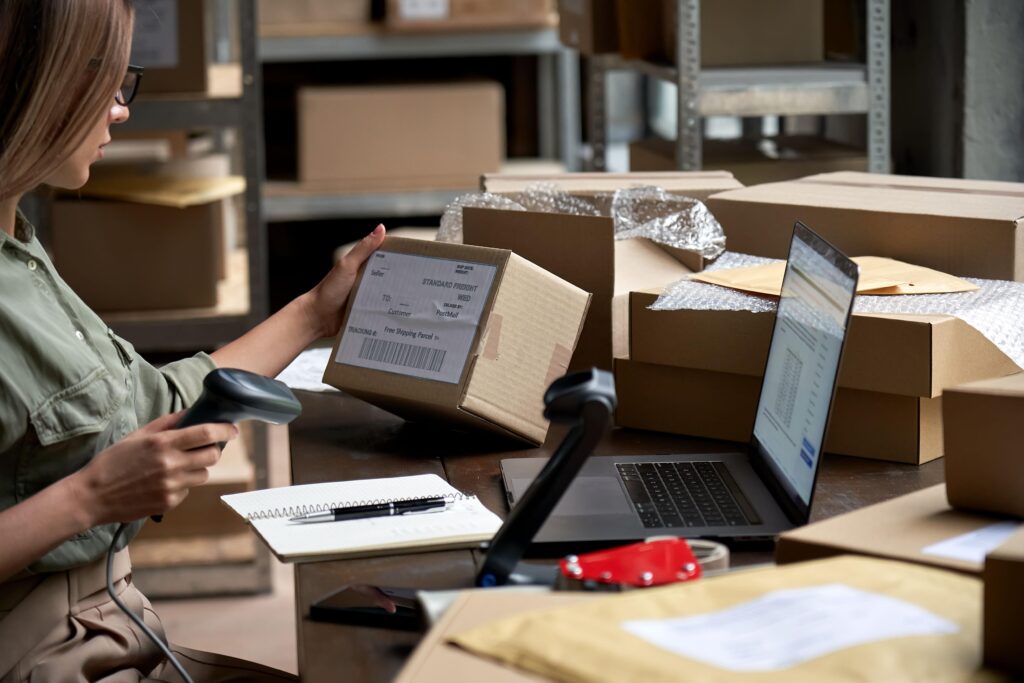 Warehouse team consolidating multiple supplier packages into one international shipment